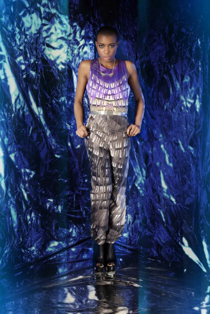 Raw silk dress with digital prints inspired by Berlin architecture in shades of blue and grey, featuring beadwork at the waist.